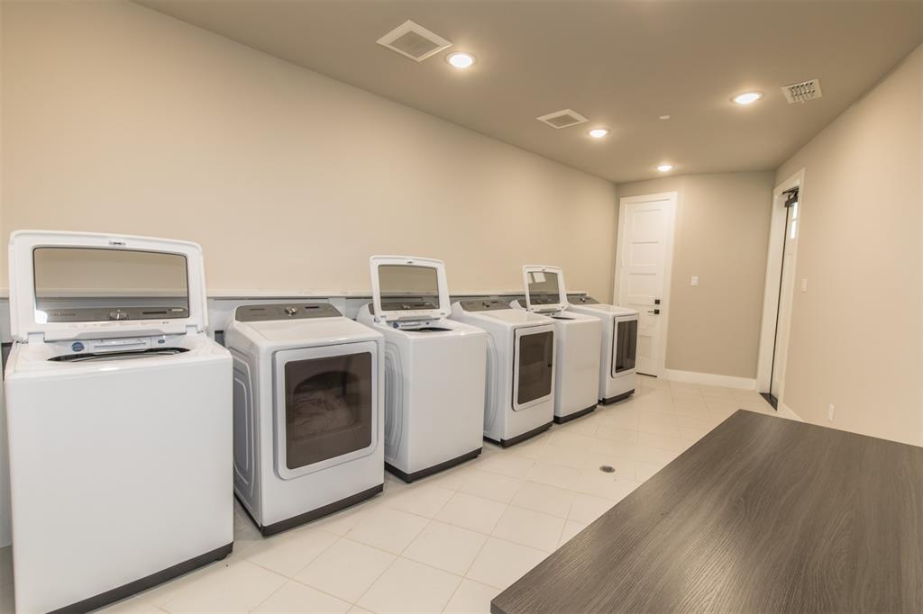 3412 Scenic Point Road, Unit 305 Graford, TX 76449 - Photo 31 of 37 a utility room with dryer and washer