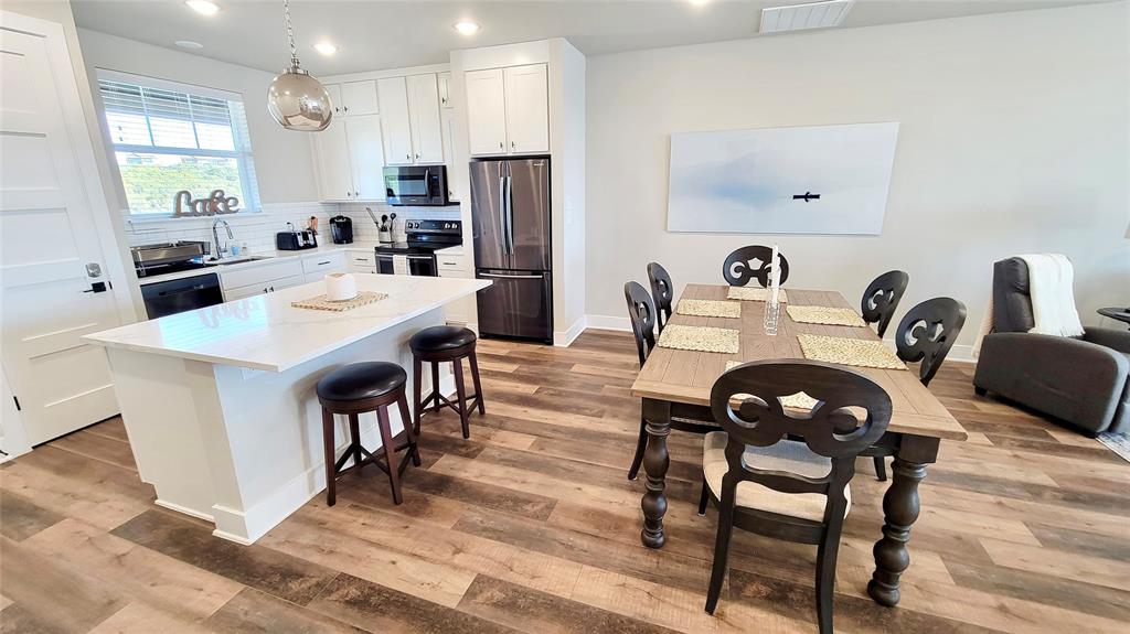 3412 Scenic Point Road, Unit 305 Graford, TX 76449 - Photo 4 of 37 a view of a dining room with furniture
