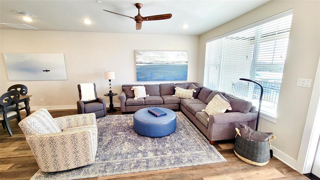 3412 Scenic Point Road, Unit 305 Graford, TX 76449 - Photo 7 of 37 a living room with furniture and a large window