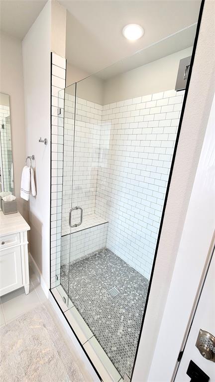 3412 Scenic Point Road, Unit 305 Graford, TX 76449 - Photo 10 of 37 a bathroom with a granite countertop sink a toilet and shower