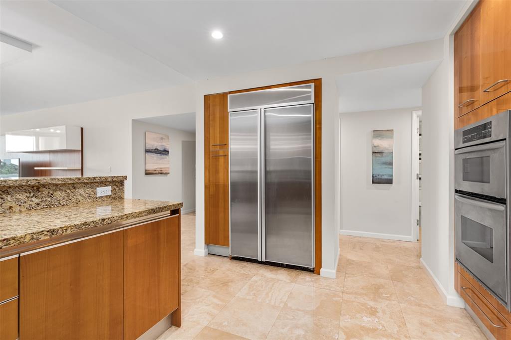 45 Hendricks Isle, Unit 403 Fort Lauderdale, FL 33301 - Photo 17 of 53 a kitchen with stainless steel appliances granite countertop a refrigerator and a sink
