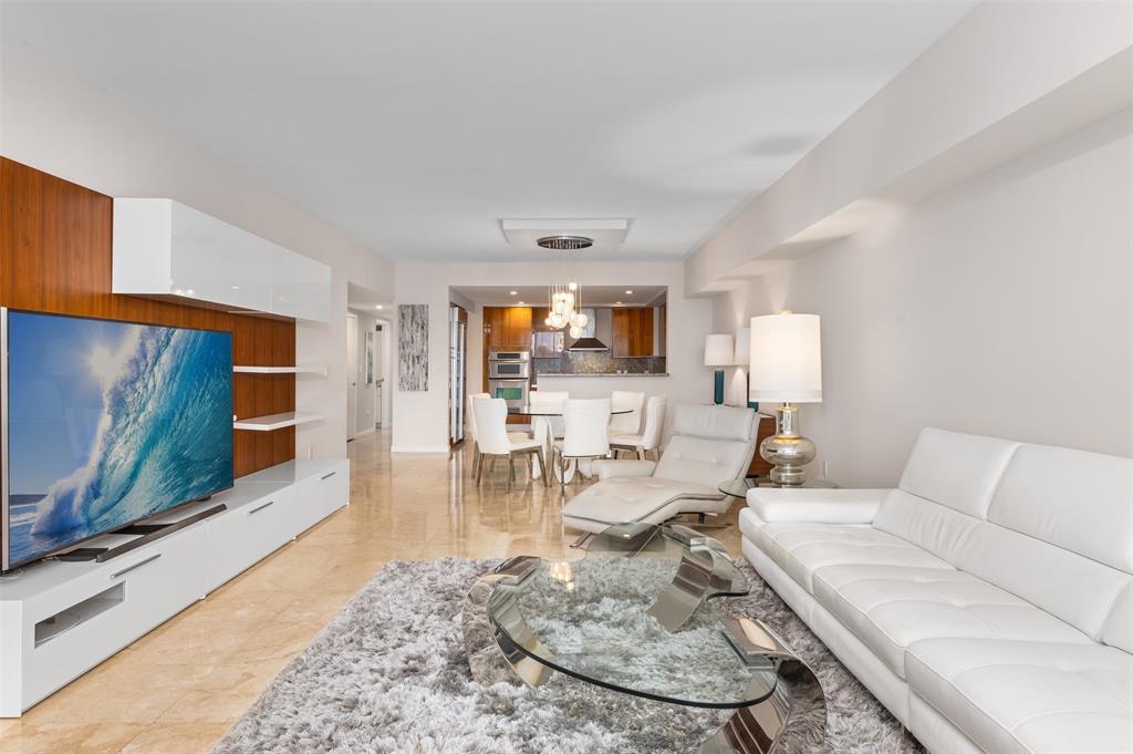 45 Hendricks Isle, Unit 403 Fort Lauderdale, FL 33301 - Photo 10 of 53 a living room with furniture and a flat screen tv