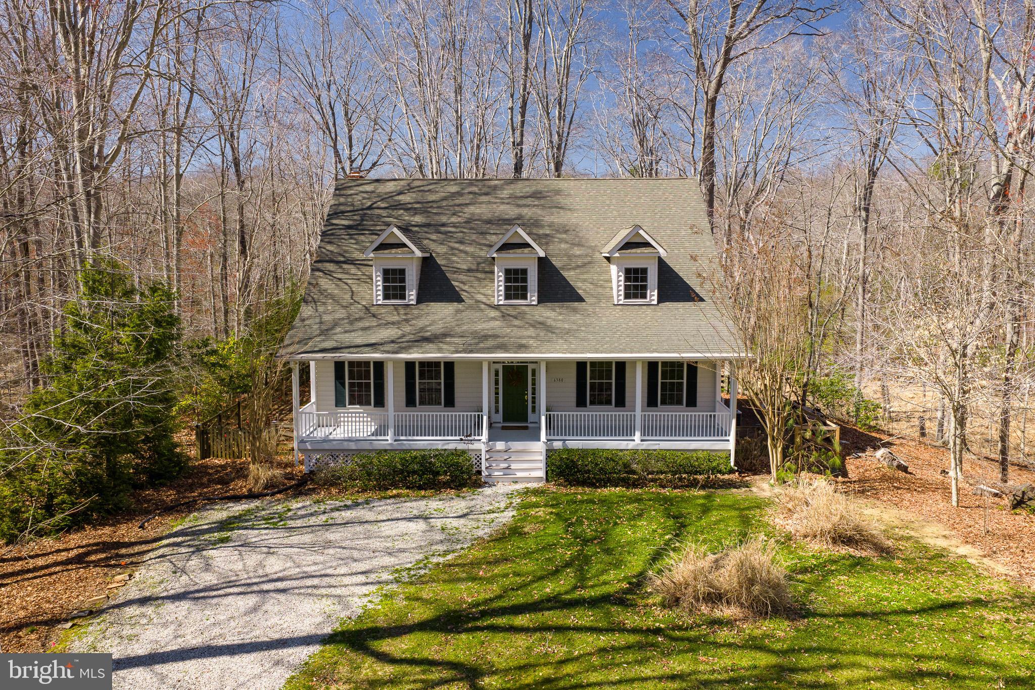 6380 Mallard Lane Lothian, MD 20711 - Photo 1 of 57 a front view of a house with a yard