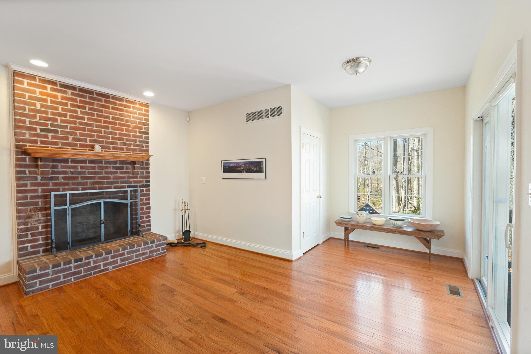 6380 Mallard Lane Lothian, MD 20711 - Photo 19 of 57 a living room with furniture and a fireplace