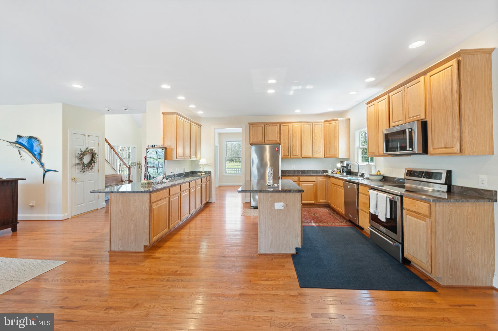 6380 Mallard Lane Lothian, MD 20711 - Photo 21 of 57 a large kitchen with stainless steel appliances lots of counter top space
