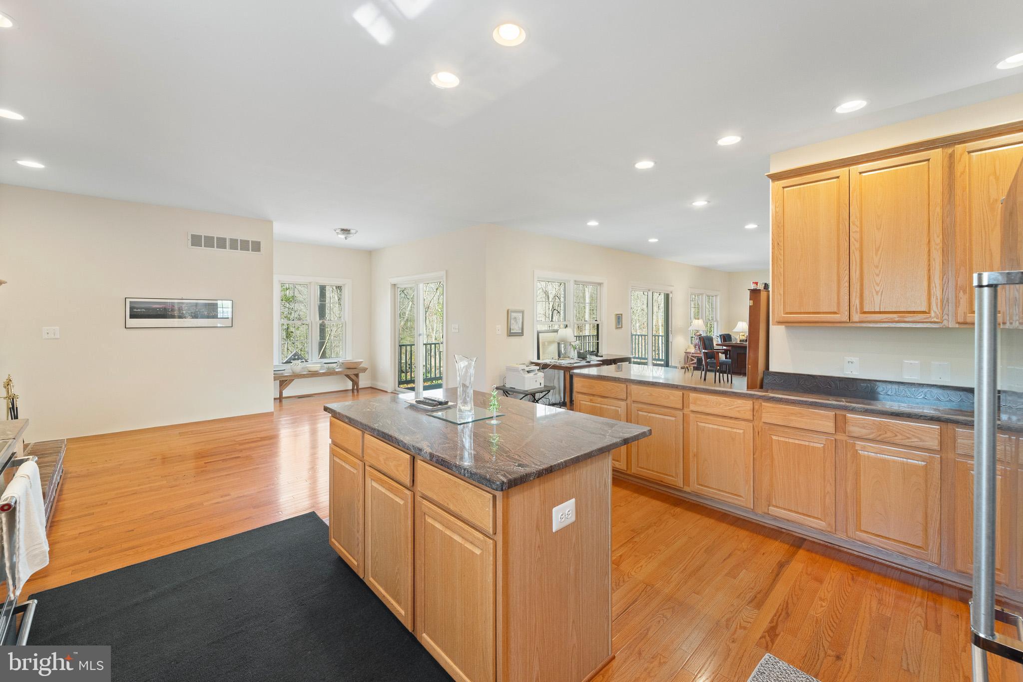 6380 Mallard Lane Lothian, MD 20711 - Photo 22 of 57 a kitchen with stainless steel appliances granite countertop a sink stove and cabinets