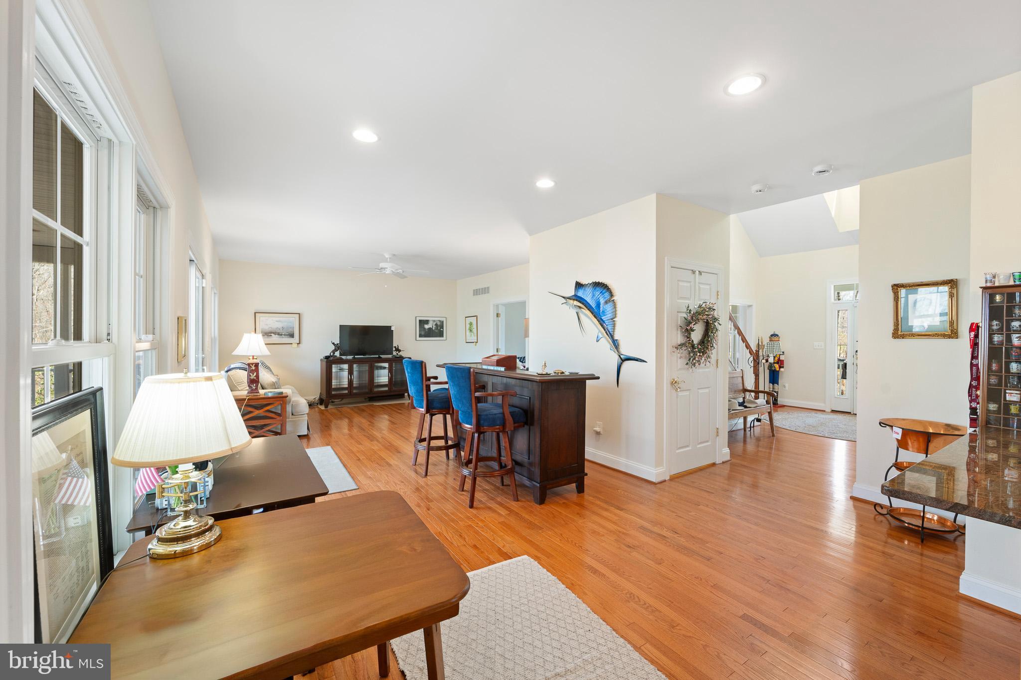 6380 Mallard Lane Lothian, MD 20711 - Photo 23 of 57 a living room with furniture pool view and a wooden floor