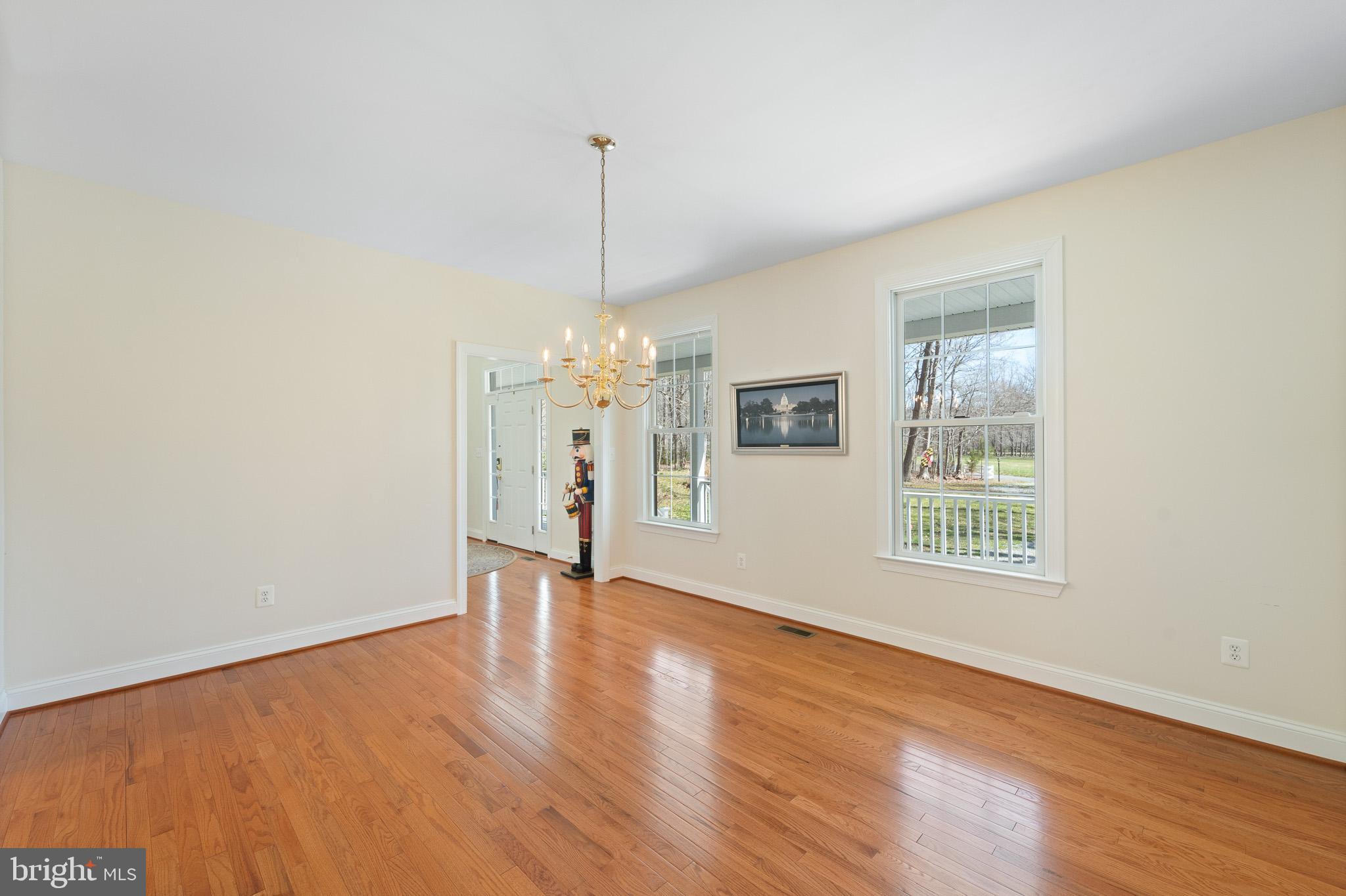 6380 Mallard Lane Lothian, MD 20711 - Photo 24 of 57 a view of an empty room with window and wooden floor