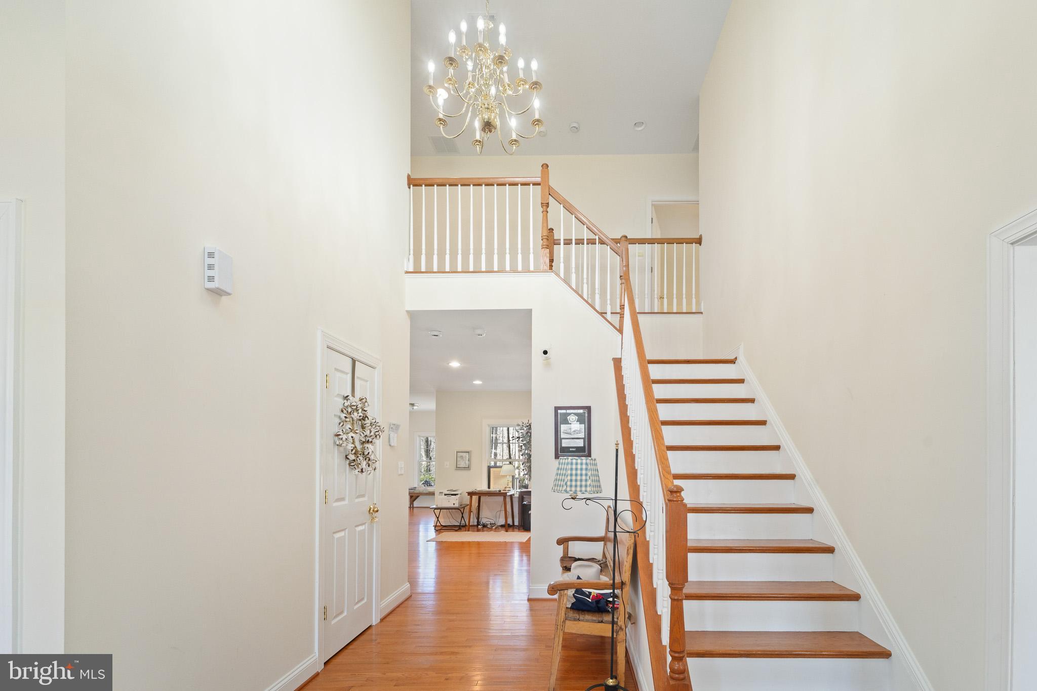 6380 Mallard Lane Lothian, MD 20711 - Photo 26 of 57 a view of entryway and hall with wooden floor