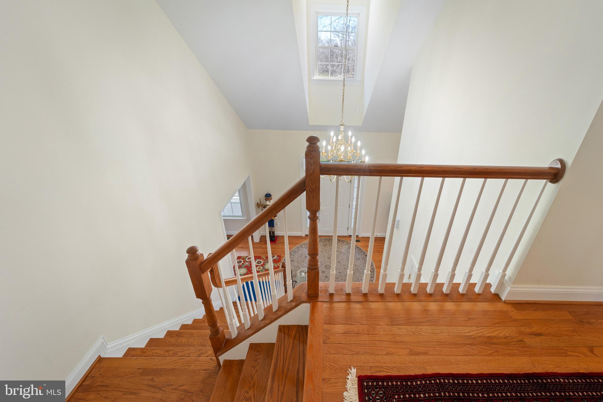6380 Mallard Lane Lothian, MD 20711 - Photo 32 of 57 a view of staircase with railing and wooden floor