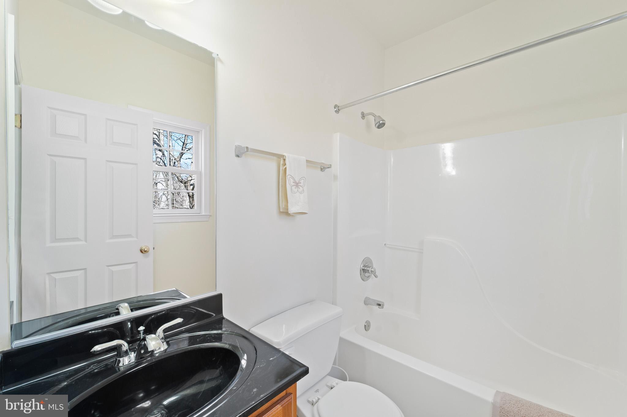 6380 Mallard Lane Lothian, MD 20711 - Photo 44 of 57 a bathroom with a sink toilet and shower
