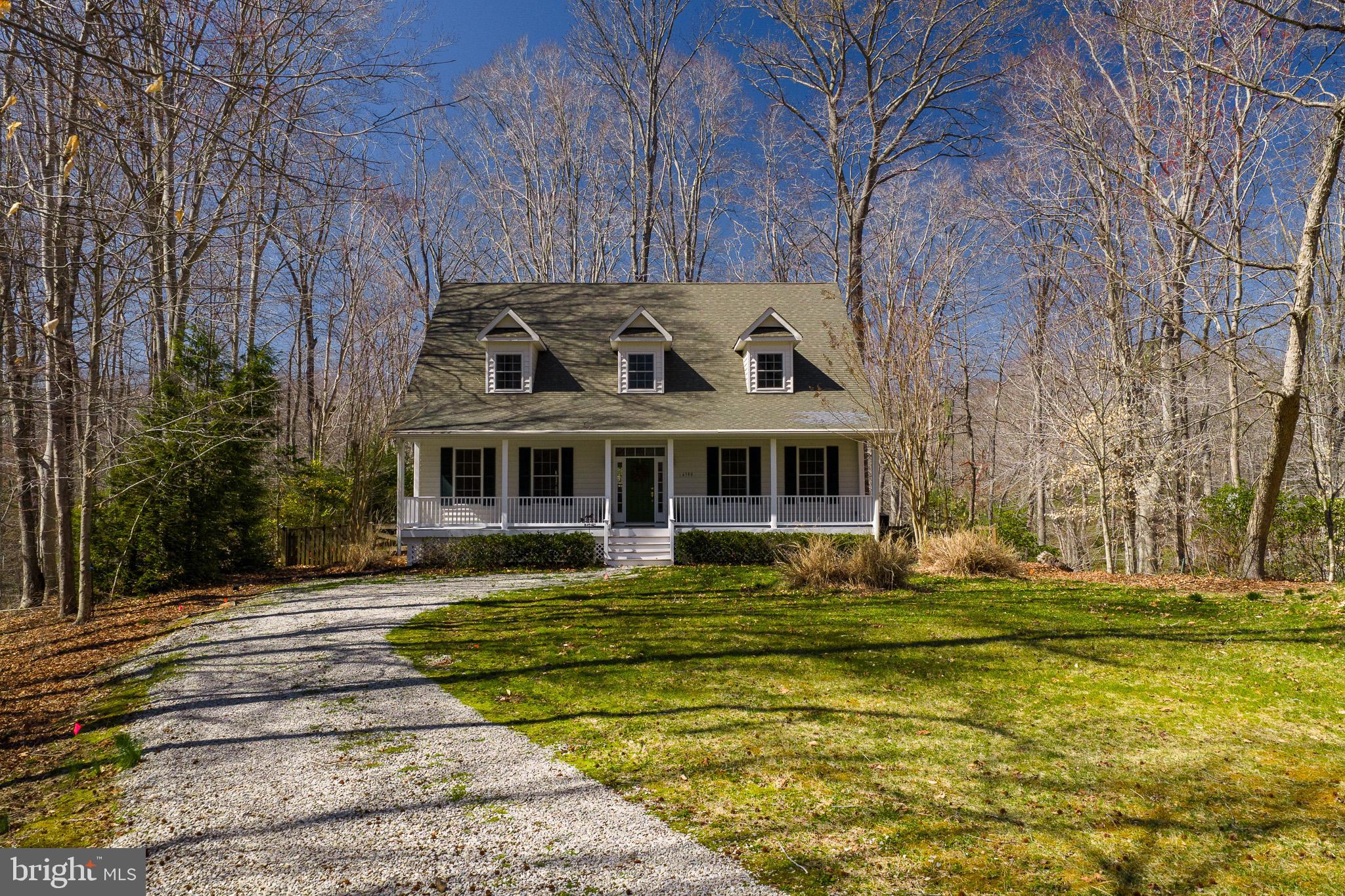 6380 Mallard Lane Lothian, MD 20711 - Photo 46 of 57 a front view of a house with a garden