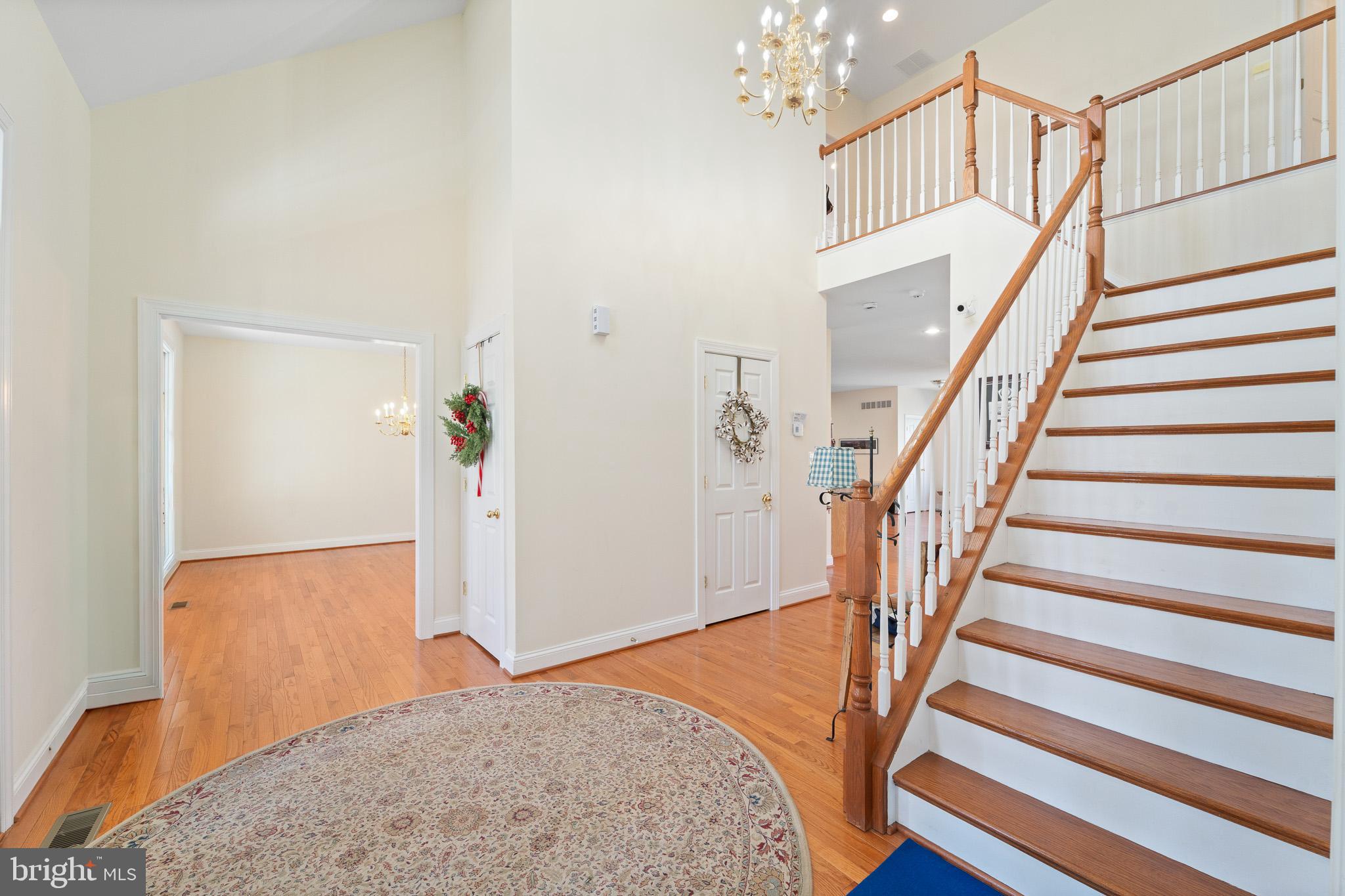 6380 Mallard Lane Lothian, MD 20711 - Photo 5 of 57 a view of a livingroom with wooden floor and stairs