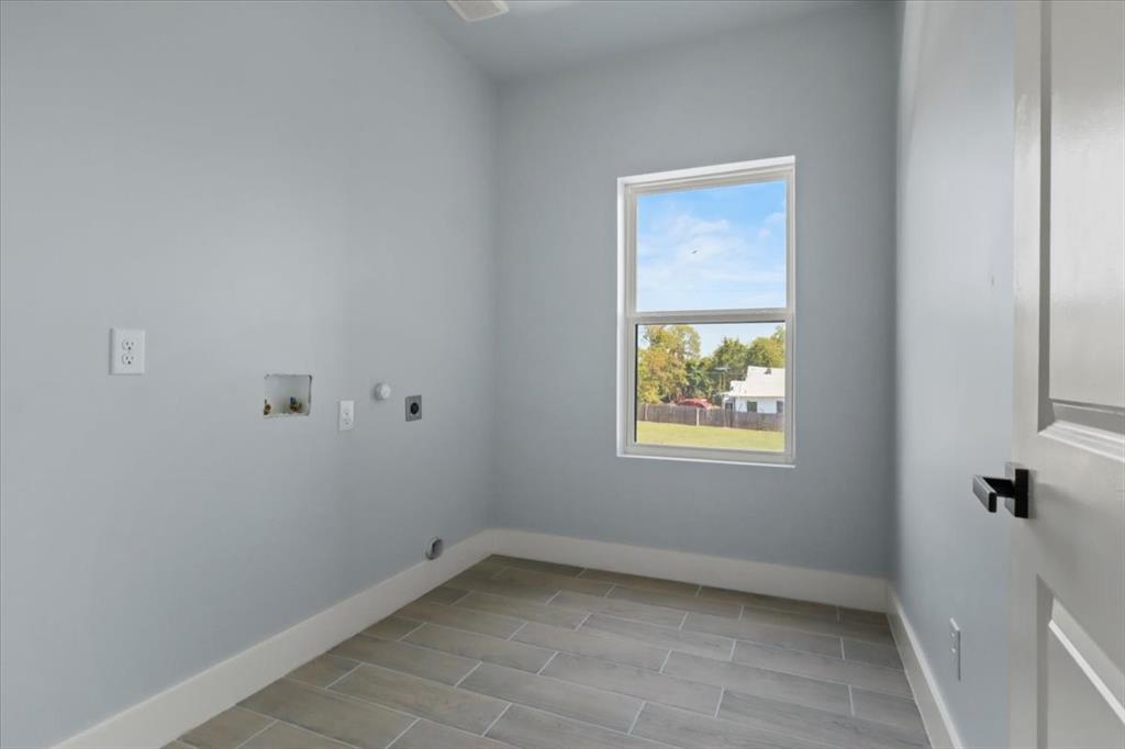 1116 East Oleander Street Fort Worth, TX 76104 - Photo 19 of 32 a view of an empty room with a window
