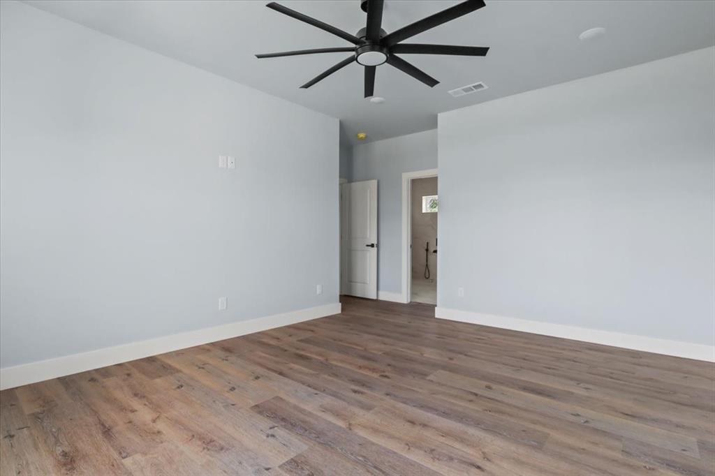 1116 East Oleander Street Fort Worth, TX 76104 - Photo 25 of 32 wooden floor in an empty room