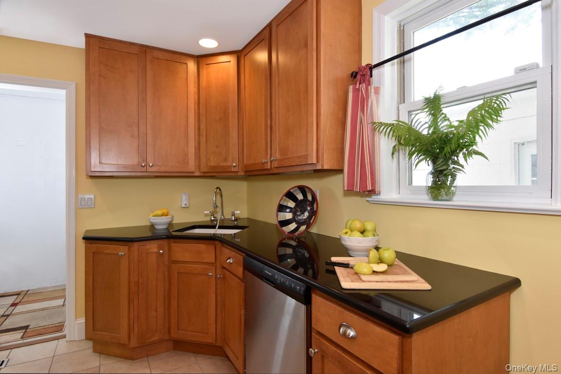 462 Bronxville Road Bronxville, NY 10708 - Photo 11 of 23 Kitchen with wood cabinets and stone countertop.