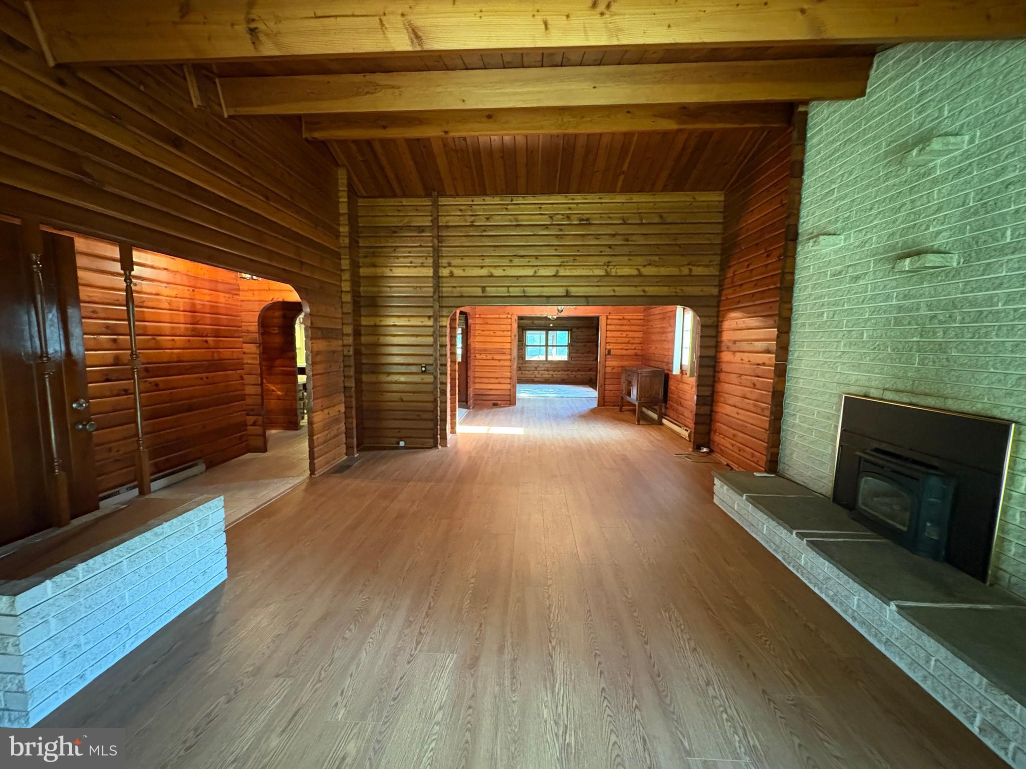 1131 Pennsy Road Pequea, PA 17565 - Photo 22 of 43 a view of empty room with wooden floor and fireplace