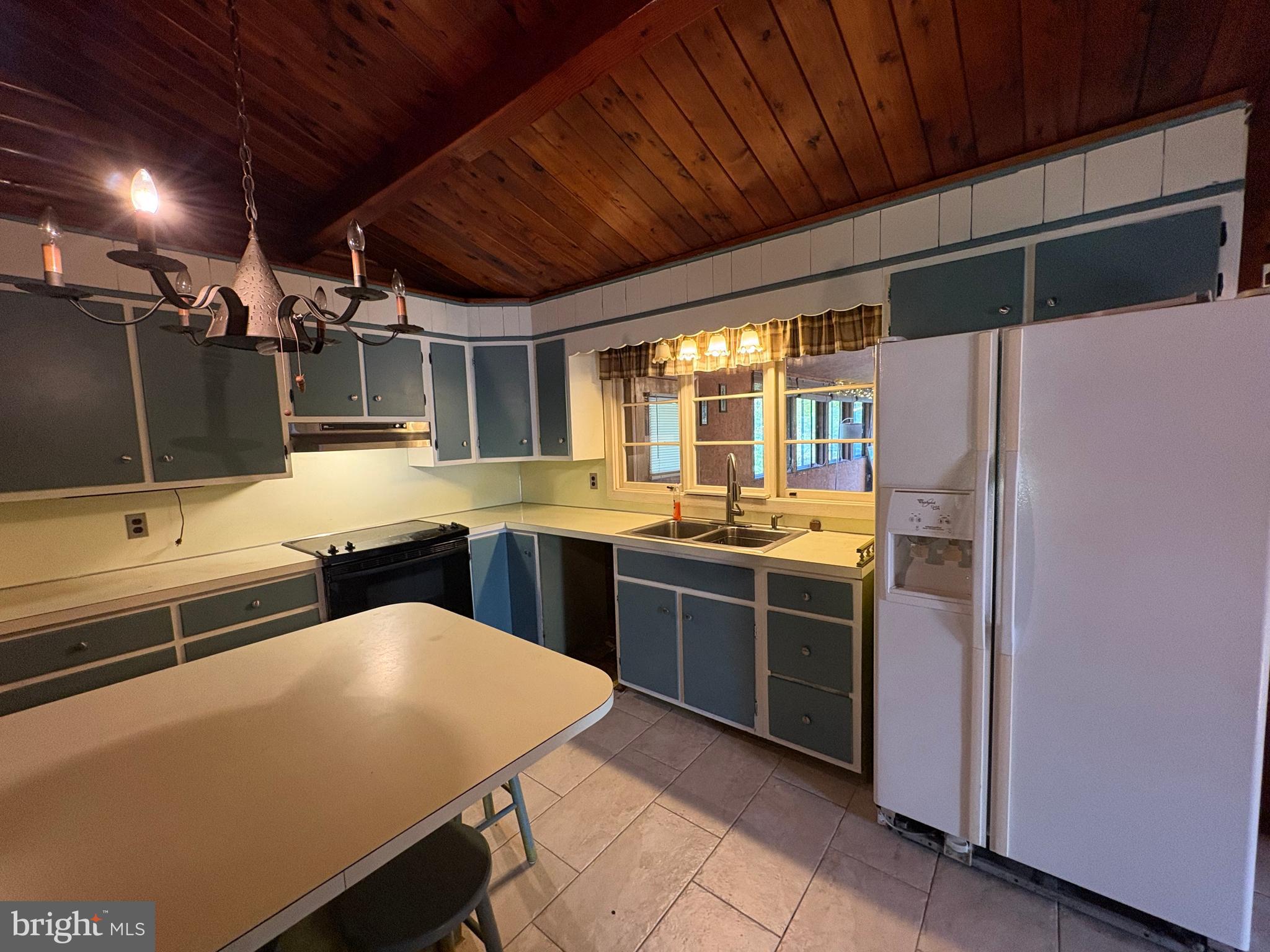 1131 Pennsy Road Pequea, PA 17565 - Photo 27 of 43 a kitchen with stainless steel appliances wooden cabinets a sink and a refrigerator