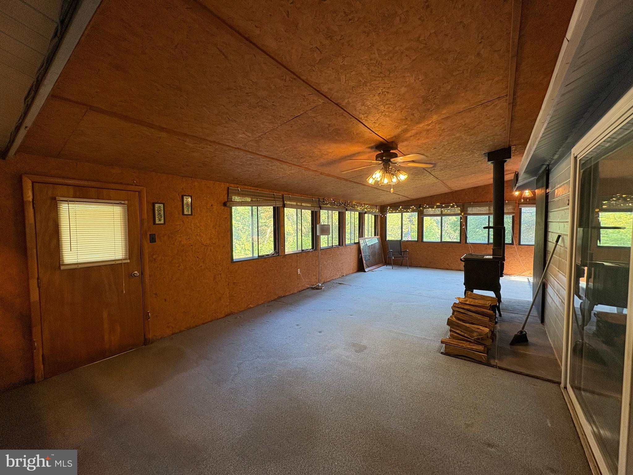 1131 Pennsy Road Pequea, PA 17565 - Photo 28 of 43 a hallway with a couches and a ceiling fan