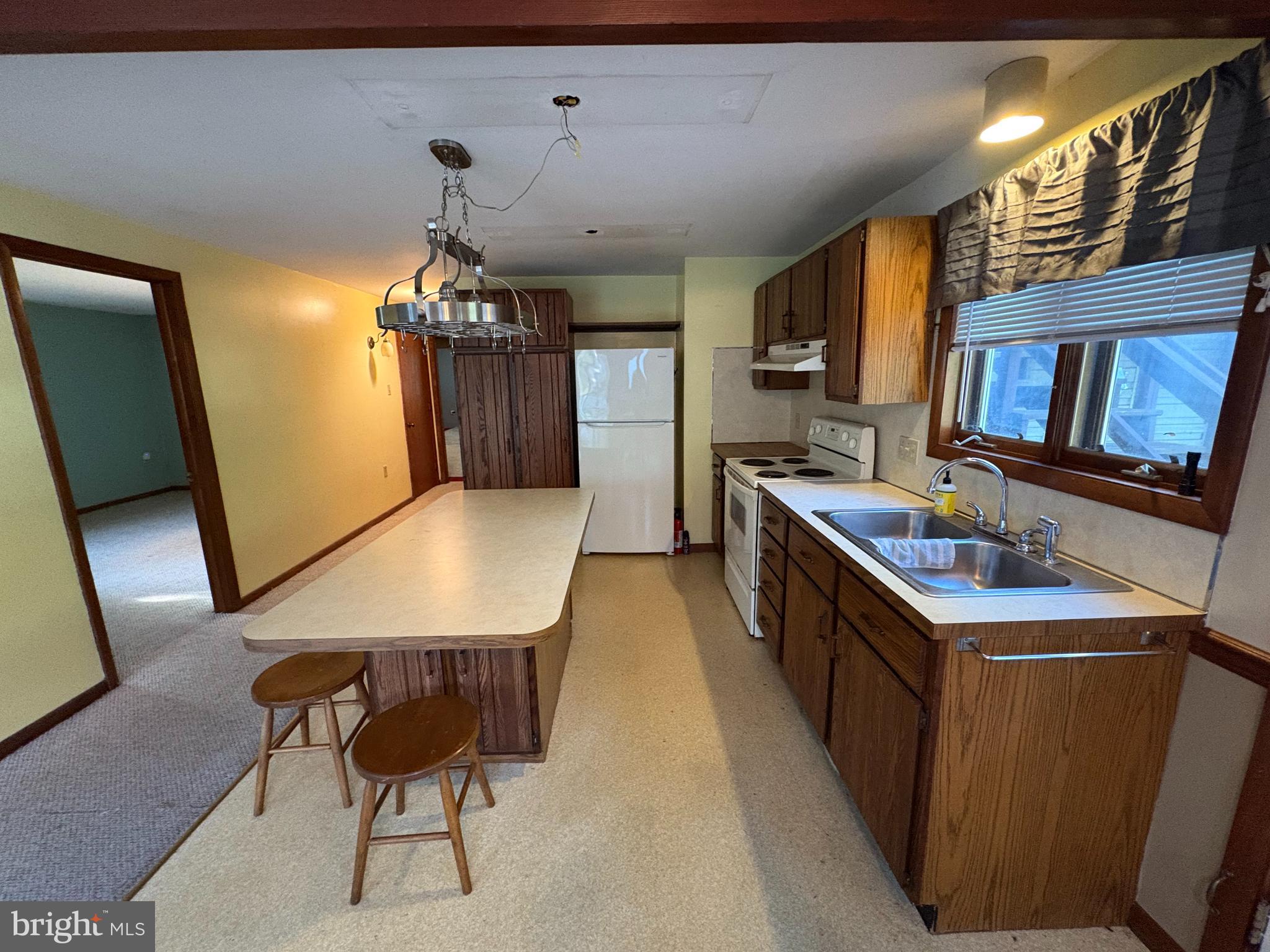 1131 Pennsy Road Pequea, PA 17565 - Photo 37 of 43 a kitchen that has a lot of cabinets in it and stainless steel appliances