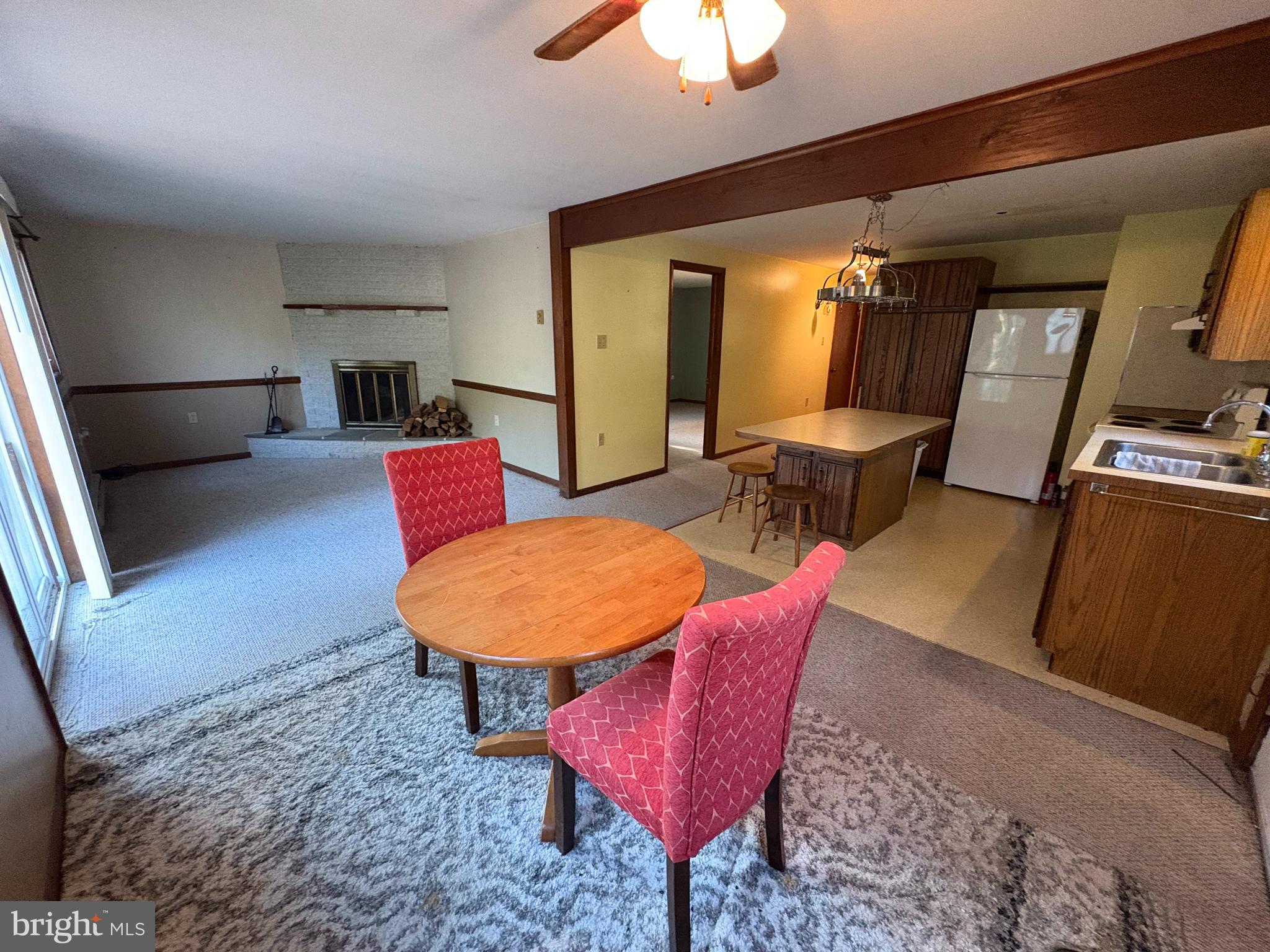 1131 Pennsy Road Pequea, PA 17565 - Photo 39 of 43 a living room with furniture a rug and a chandelier