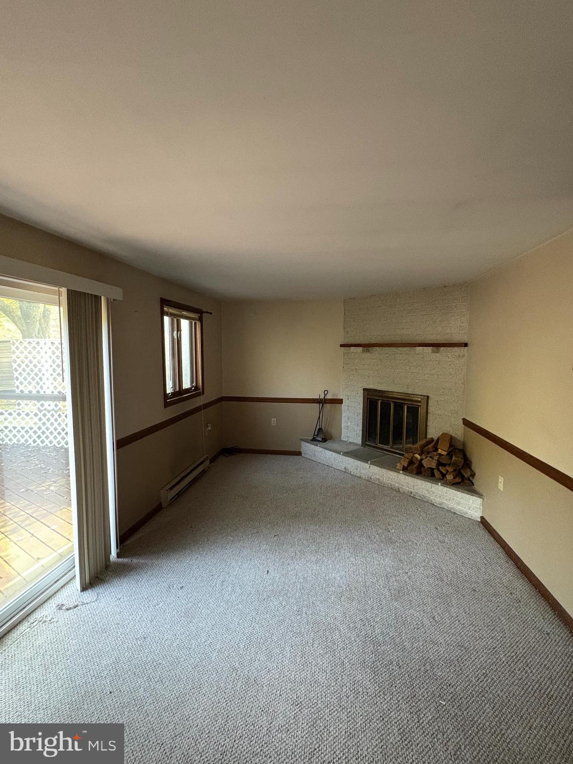 1131 Pennsy Road Pequea, PA 17565 - Photo 40 of 43 a view of empty room with fireplace and windows