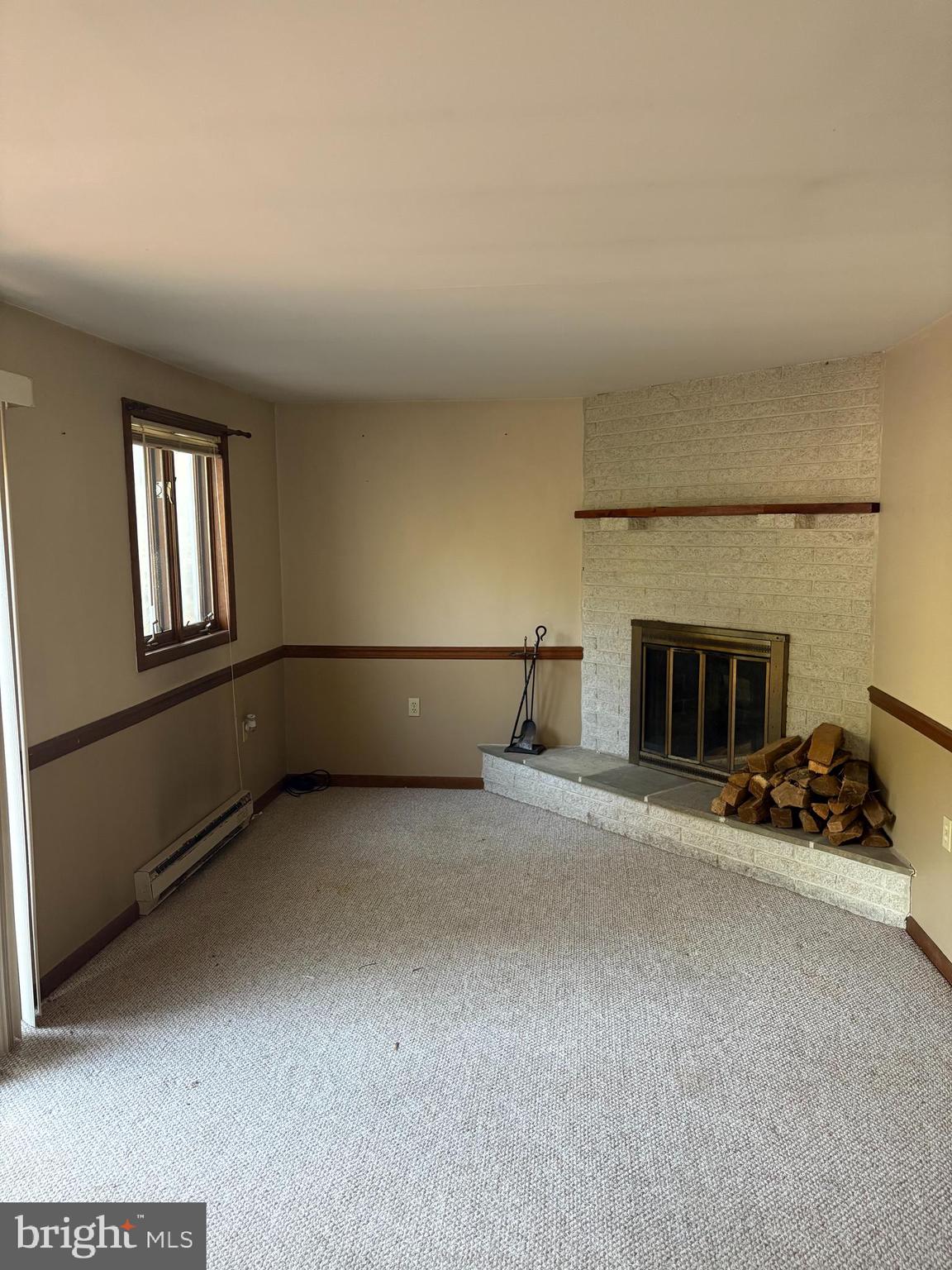 1131 Pennsy Road Pequea, PA 17565 - Photo 41 of 43 a furnished livingroom with a fireplace and window