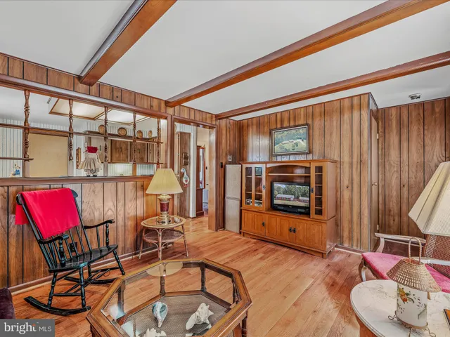 a bedroom with a large bed and a dresser