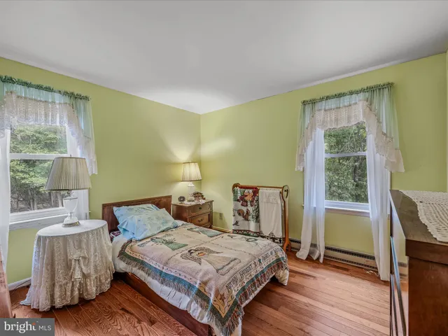 a room with furniture pool table and windows