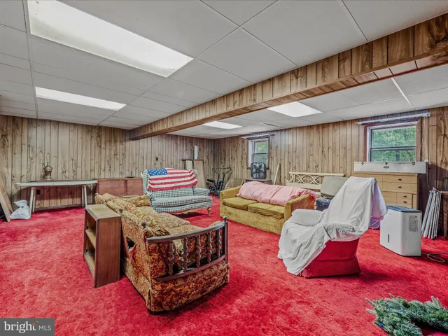 a view of a storage room with furniture and a window