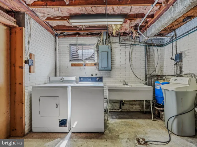 a view of a house with a backyard and garage