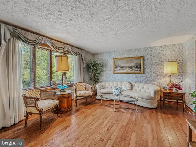 a kitchen that has a stove and a table in it