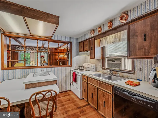 a work place with furniture and wooden floor