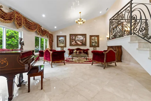 a kitchen with stainless steel appliances kitchen island granite countertop a refrigerator and stove