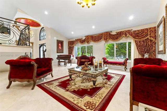 a kitchen with stainless steel appliances granite countertop a sink and a refrigerator