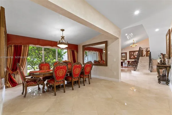 a kitchen with granite countertop stainless steel appliances and wooden cabinets