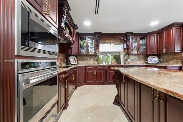 a living room with furniture gym equipment and a chandelier