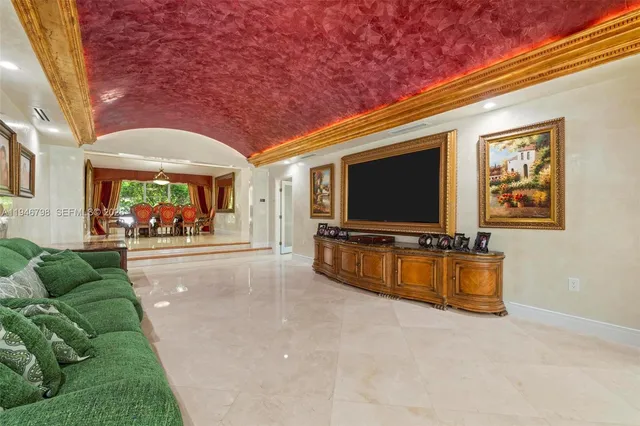 a view of a patio with table and chairs and potted plants