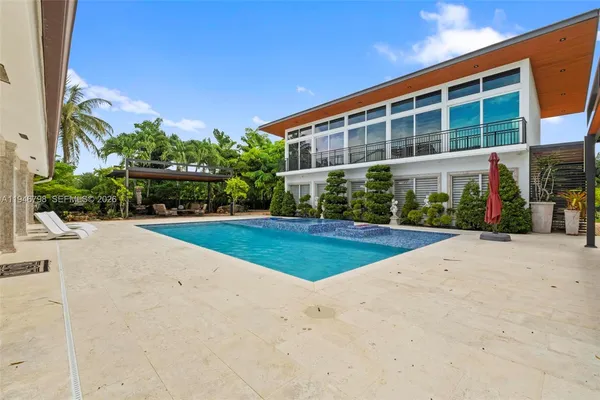 a view of a backyard with a sitting area