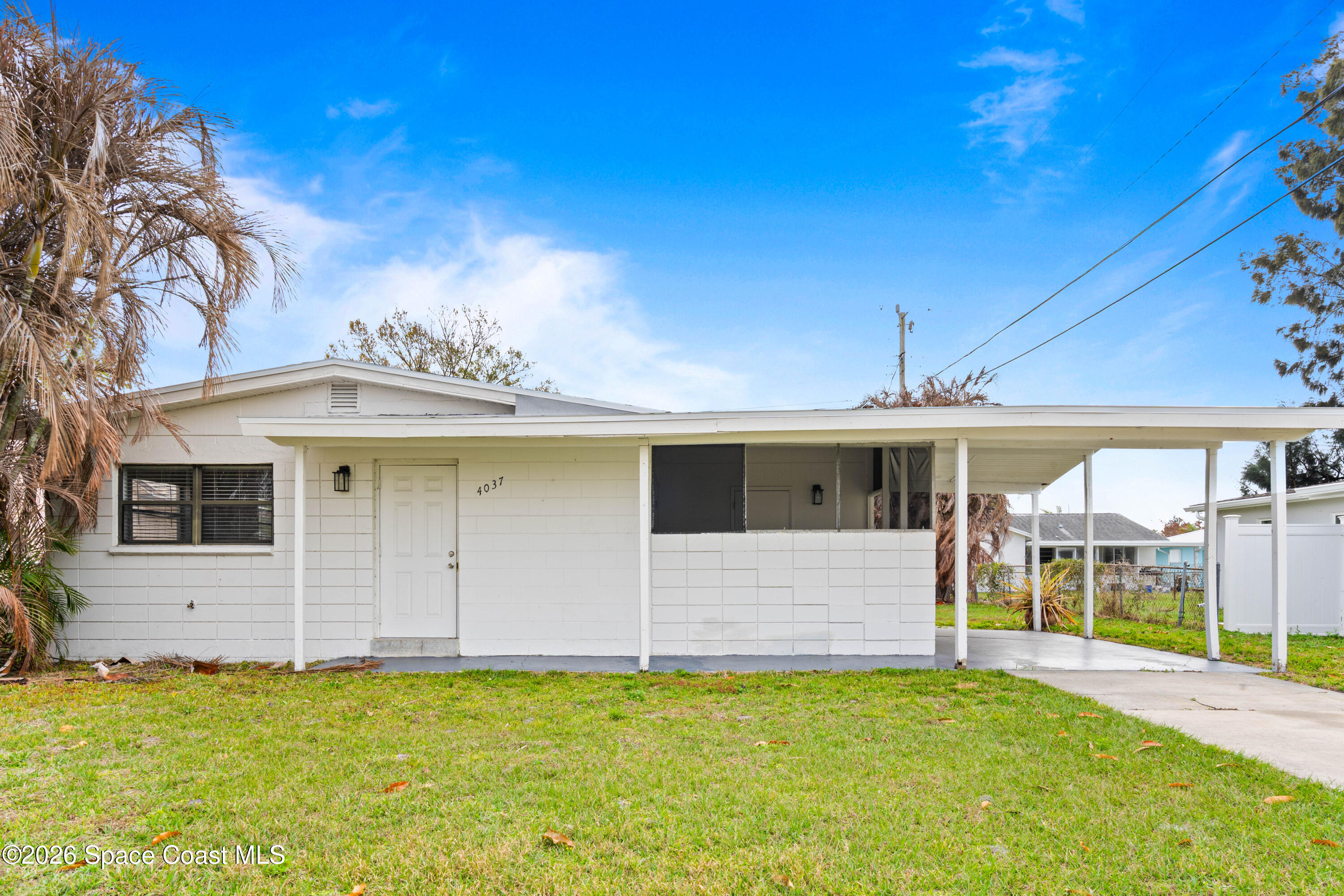 4037 Edwards Street Melbourne, FL 32901 - Photo 1 of 20 a front view of a house with swimming pool