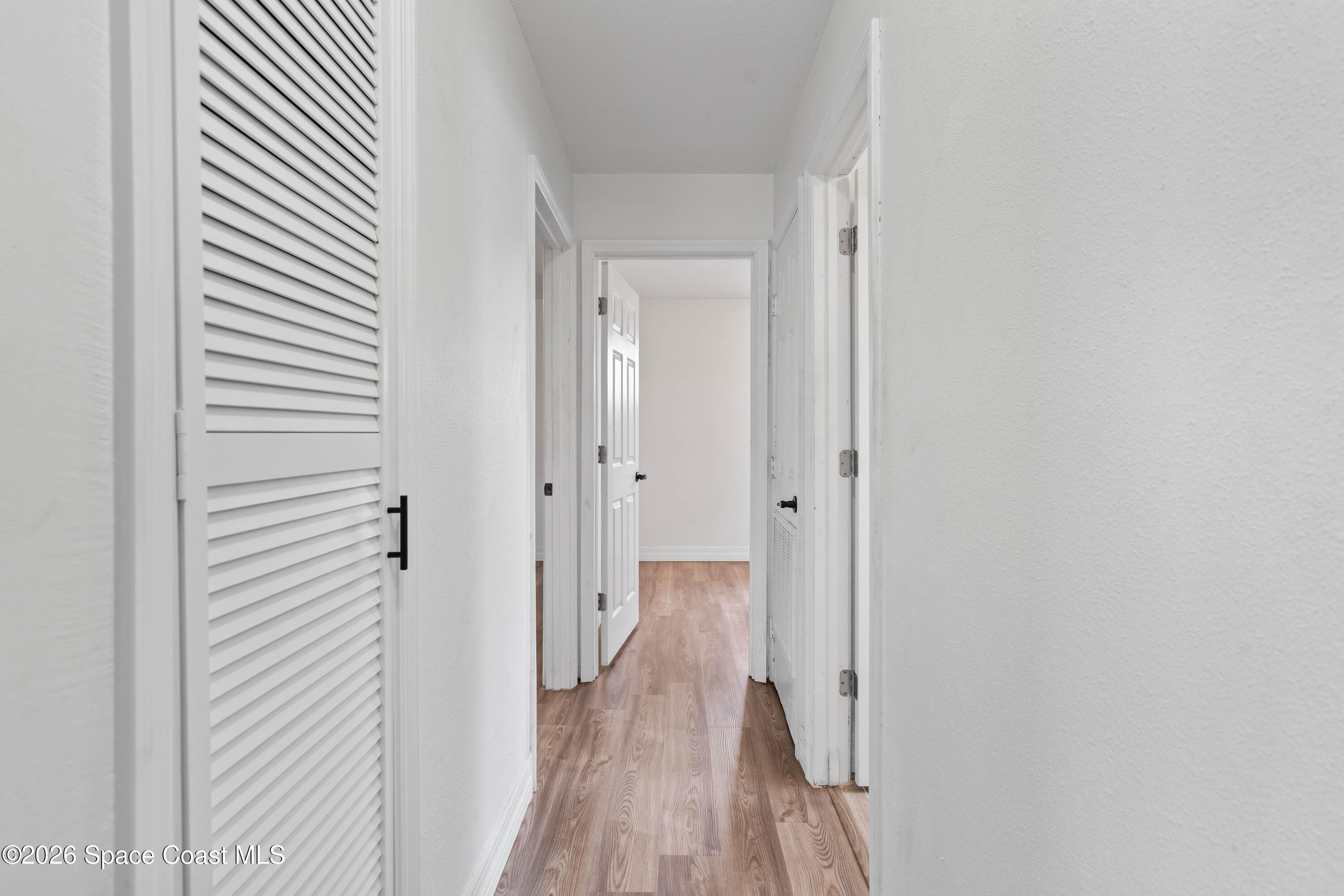 4037 Edwards Street Melbourne, FL 32901 - Photo 11 of 20 a view of a hallway with wooden floor