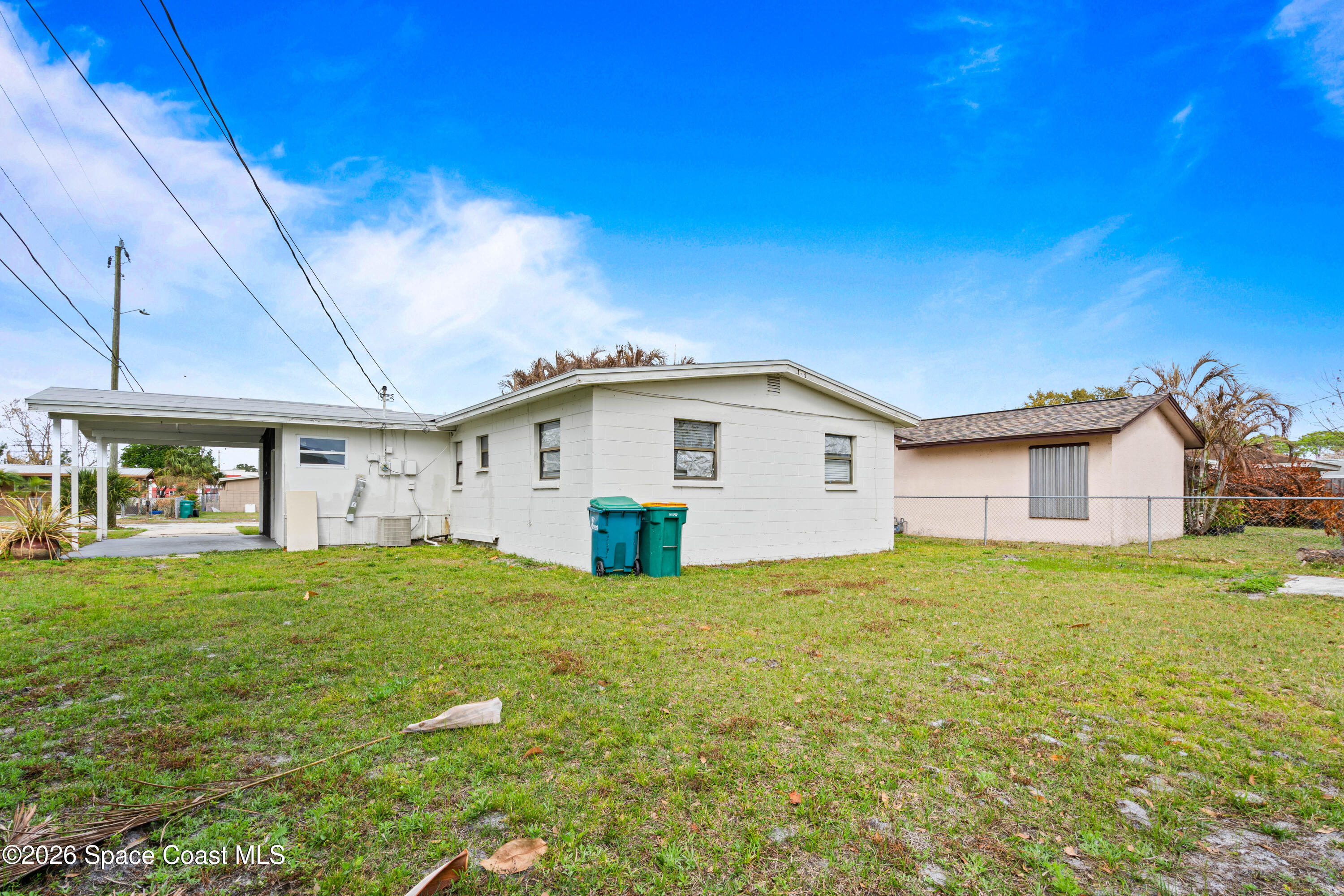 4037 Edwards Street Melbourne, FL 32901 - Photo 19 of 20 a view of a house with a yard