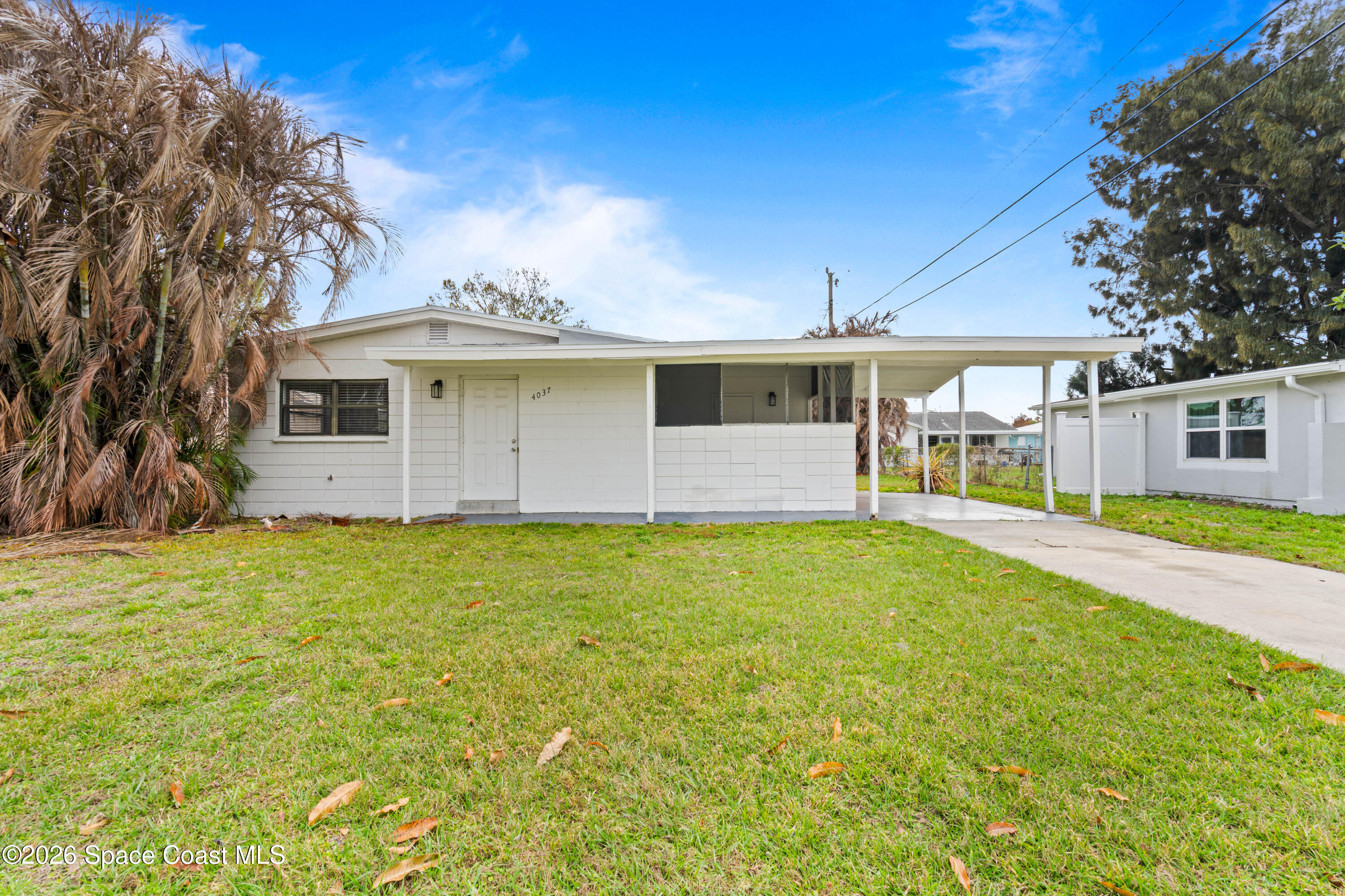 4037 Edwards Street Melbourne, FL 32901 - Photo 2 of 20 a front view of house with yard and seating