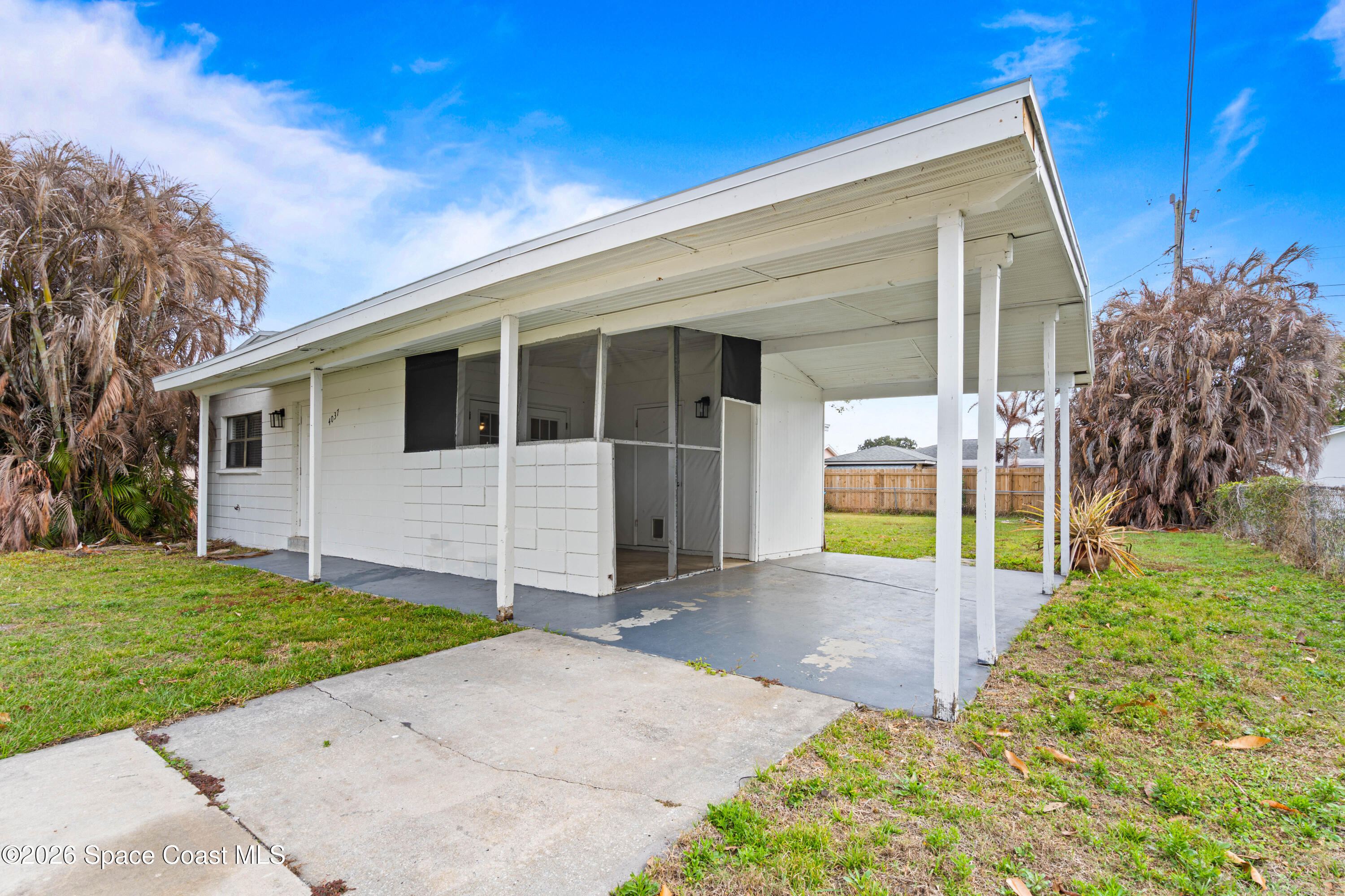 4037 Edwards Street Melbourne, FL 32901 - Photo 4 of 20 a view of a house with backyard and garden