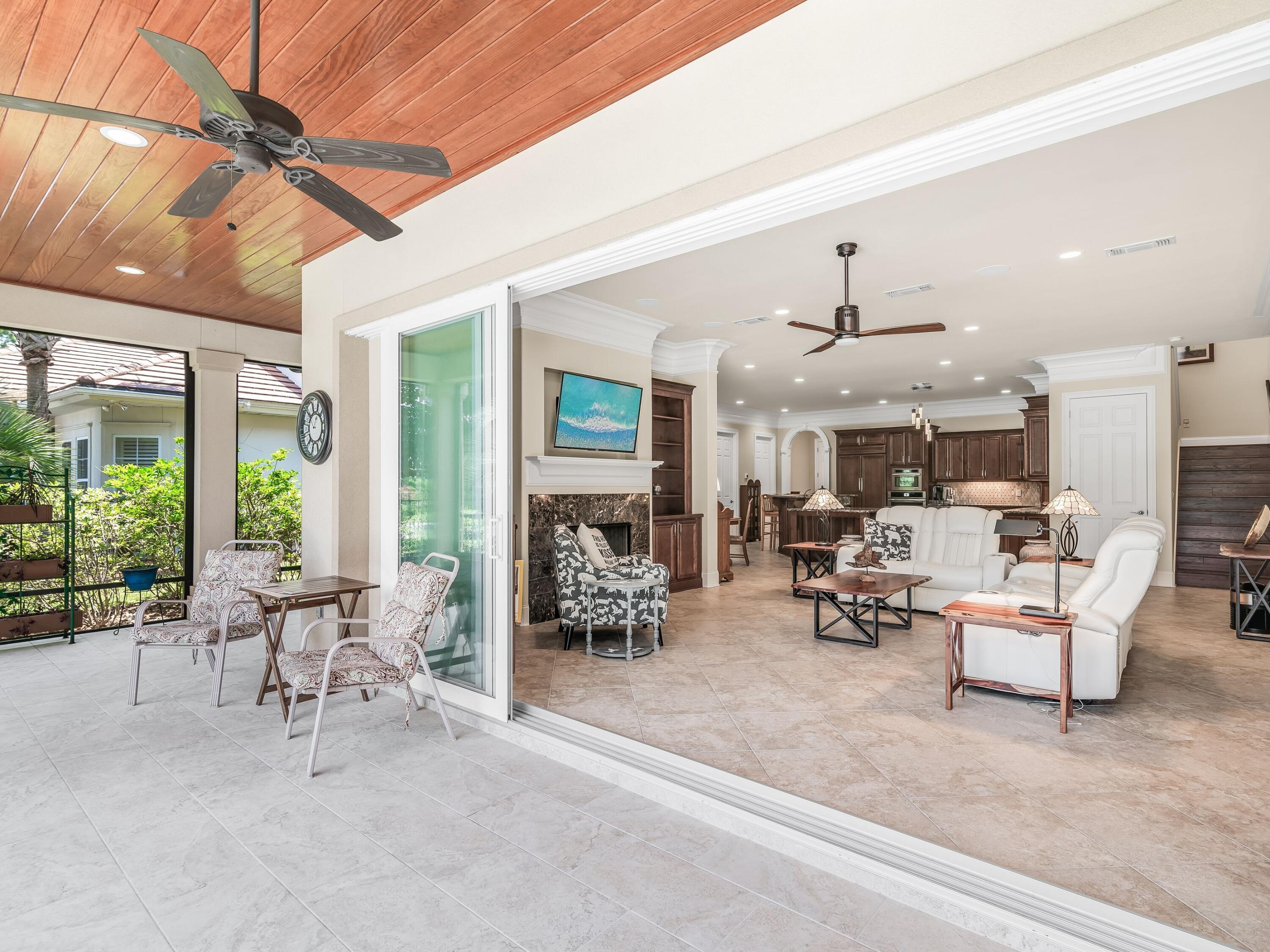 2916 Pine Valley Drive Sandestin, FL 32550 - Photo 12 of 48 a living room with furniture and a chandelier