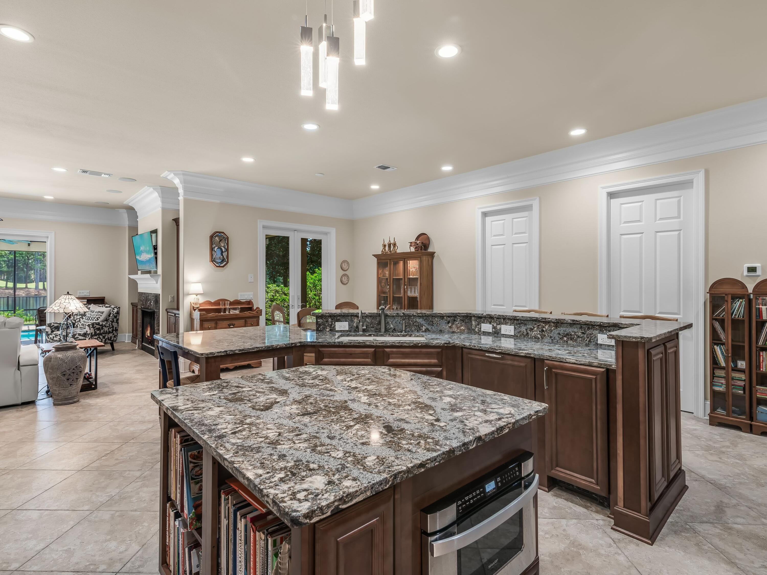 2916 Pine Valley Drive Sandestin, FL 32550 - Photo 22 of 48 a dining hall with stainless steel appliances granite countertop a stove and a sink