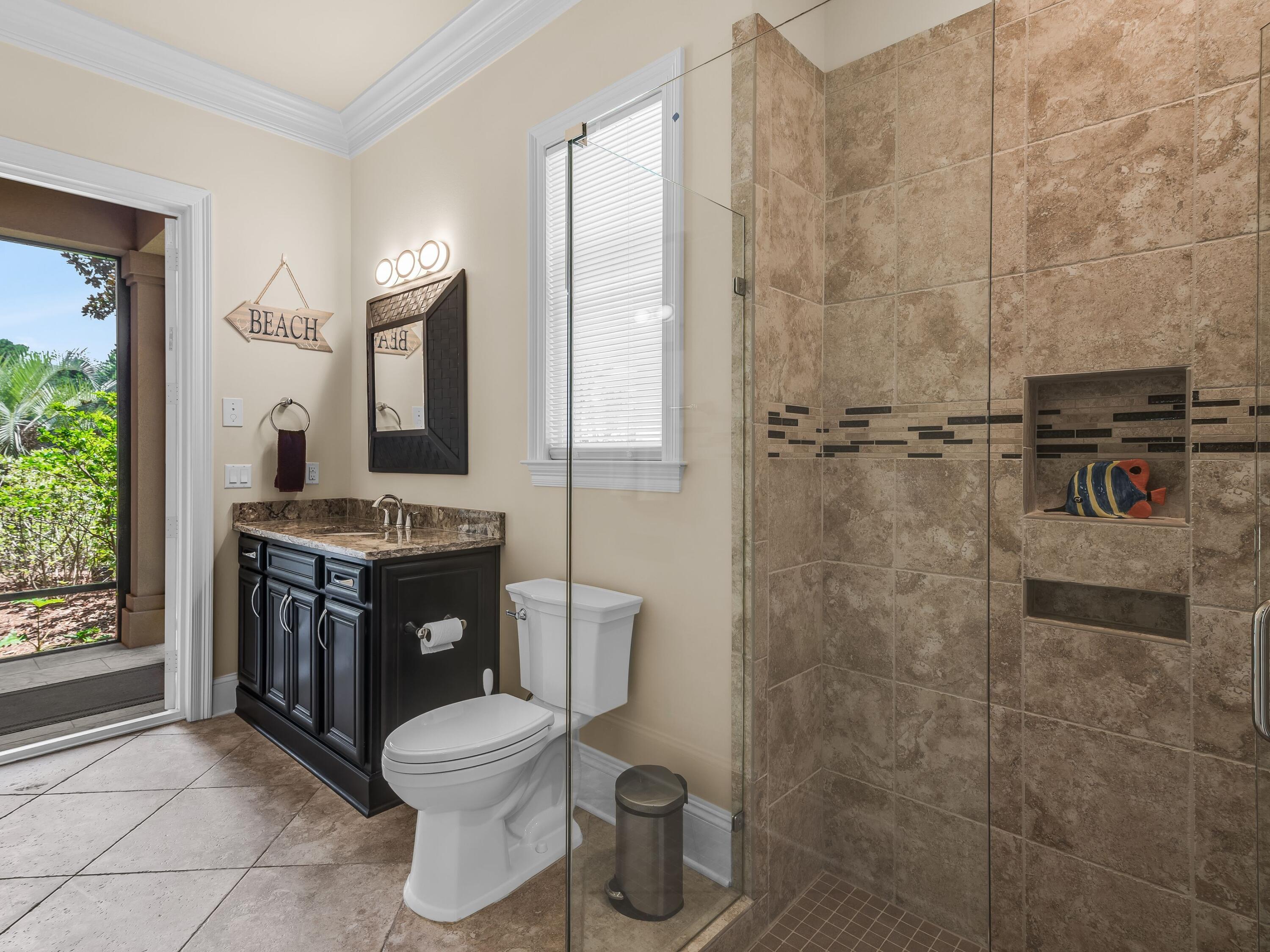 2916 Pine Valley Drive Sandestin, FL 32550 - Photo 24 of 48 a bathroom with a toilet a sink and shower