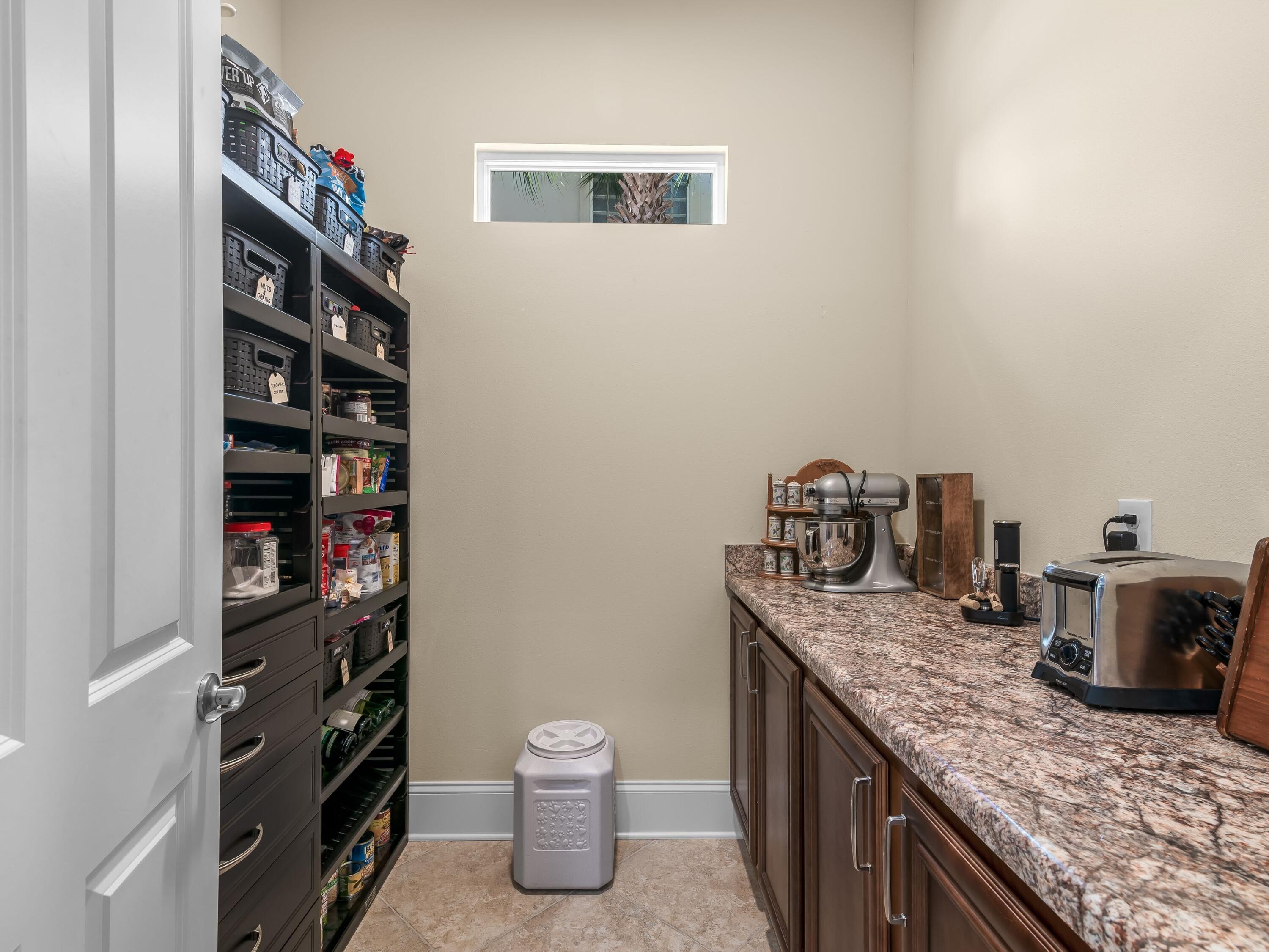 2916 Pine Valley Drive Sandestin, FL 32550 - Photo 25 of 48 a kitchen with a sink and cabinets