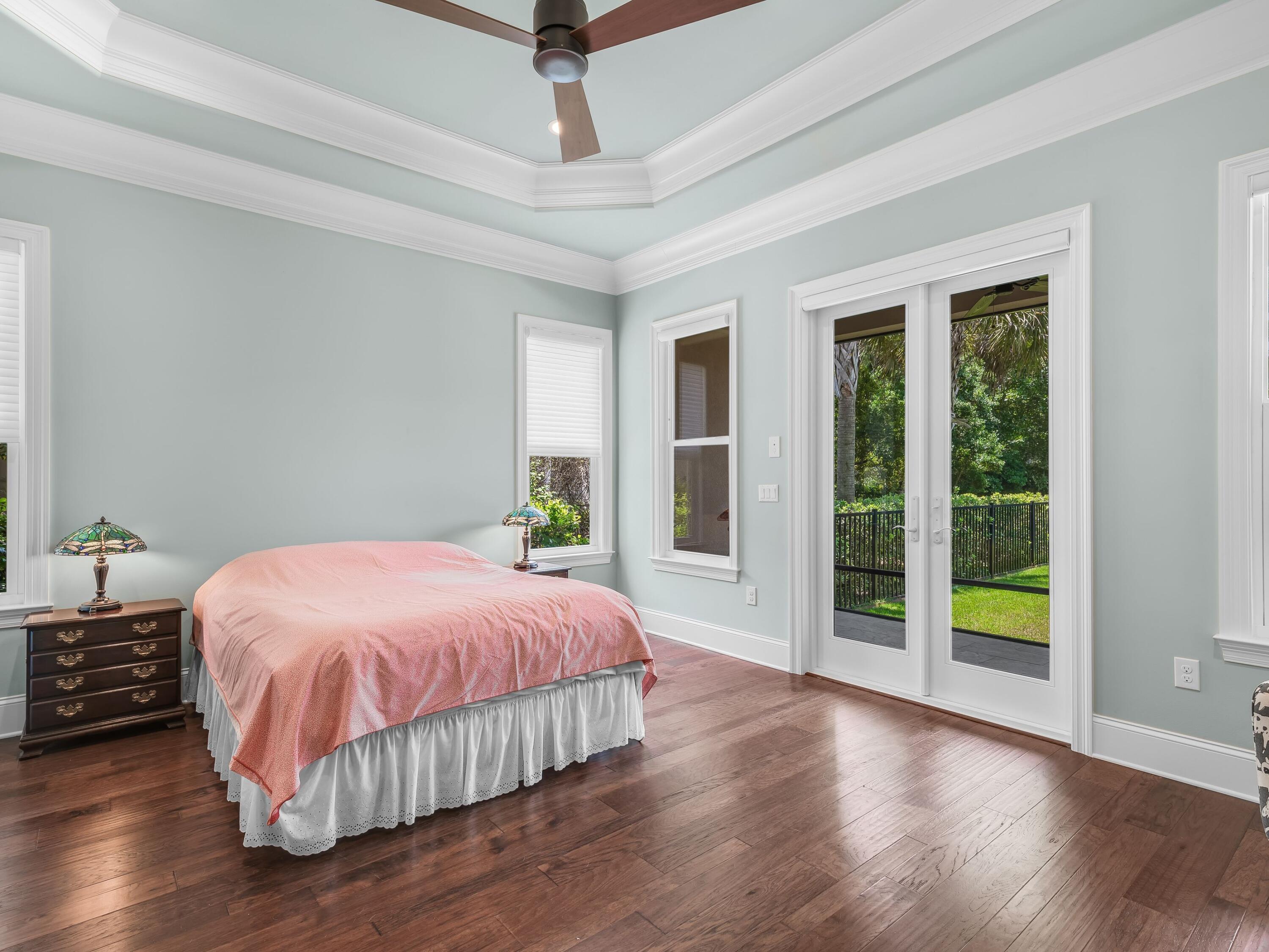 2916 Pine Valley Drive Sandestin, FL 32550 - Photo 27 of 48 a bedroom with a large bed and a large window