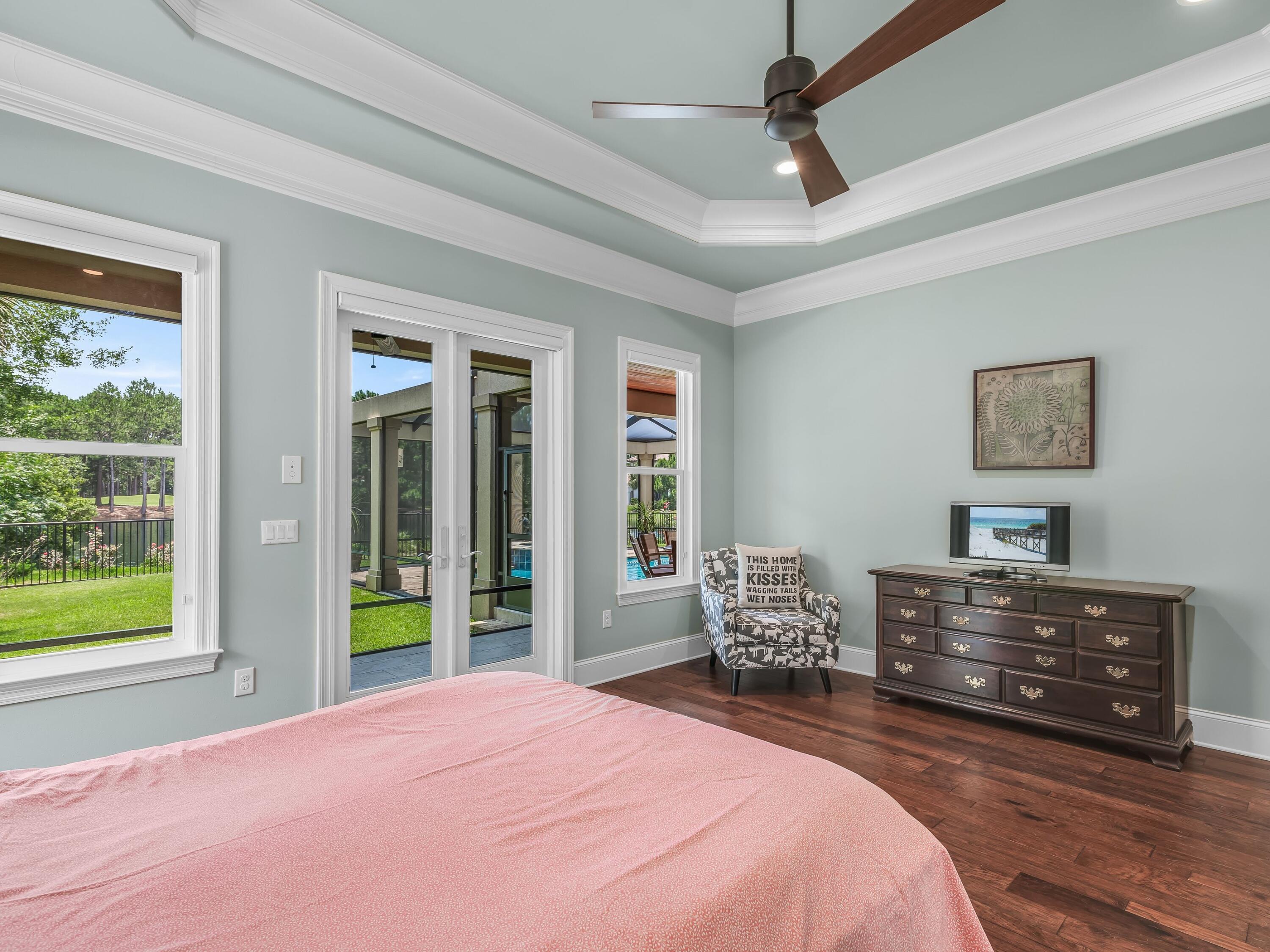 2916 Pine Valley Drive Sandestin, FL 32550 - Photo 28 of 48 a bedroom with a bed and wooden floor